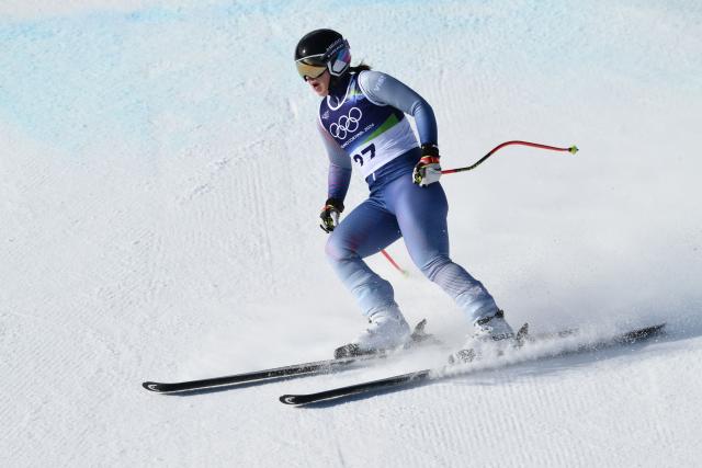 Individual Neutral Athlete Julia Pleshkova reacts in the finish area of the women's downhill event during the Milano Cortina 2026 Winter Olympic Games at the Tofane Alpine Skiing Centre in Cortina d’Ampezzo on February 8, 2026. (Photo by Marco BERTORELLO / AFP)