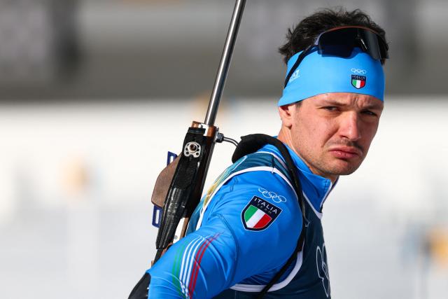 Italy's Tommaso Giacomel looks on ahea of the mixed biathlon 4 x 6km relay event during the Milano Cortina 2026 Winter Olympic Games at the Anterselva Biathlon Arena (Sudtirol Arena) in Anterselva (Val Pusteria) on February 8, 2026. (Photo by FRANCK FIFE / AFP)