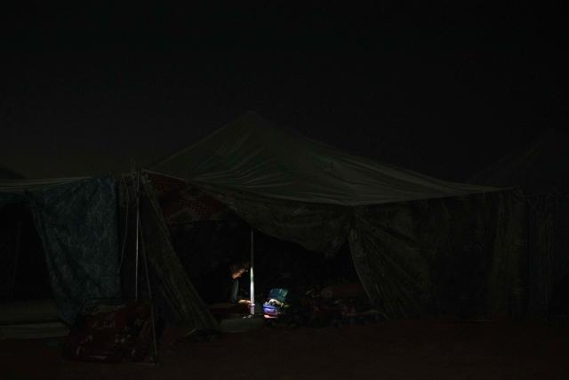 A Blue March participant rests in tent accommodation in the village of Teichott at the Banc d’Arguin on February 6, 2026. The Blue March held its second edition this year at the Banc d’Arguin, a UNESCO World Heritage site marking its 50th anniversary. The citizen-led artistic and environmental initiative is organised by the Mauritanian Environmental Association (AME), and was initiated by Mauritanian-born Malian film director Abderrahmane Sissako and Senegalese screenwriter Kessen Fatoumata Tall.
The week-long collective walk aims to raise awareness of Mauritania’s biodiversity and foster dialogue on climate change and desertification among researchers, artists and policymakers. (Photo by Kang-Chun Cheng / AFP)
