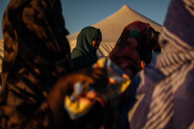 Women from the village of Teichott gather near the camp where participants of The Blue March spent the night at the Banc d’Arguin on February 6, 2026. The Blue March held its second edition this year at the Banc d’Arguin, a UNESCO World Heritage site marking its 50th anniversary. The citizen-led artistic and environmental initiative is organised by the Mauritanian Environmental Association (AME), and was initiated by Mauritanian-born Malian film director Abderrahmane Sissako and Senegalese screenwriter Kessen Fatoumata Tall.
The week-long collective walk aims to raise awareness of Mauritania’s biodiversity and foster dialogue on climate change and desertification among researchers, artists and policymakers. (Photo by Kang-Chun Cheng / AFP)
