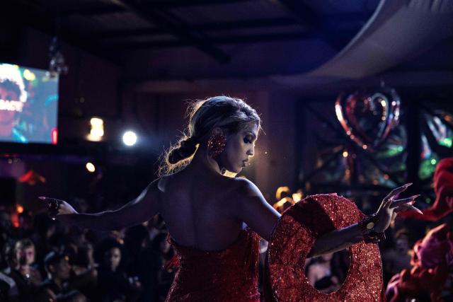A participant walks the runway during competitions at the Love Pride Ball in Cape Town on February 7, 2026. Ballroom culture emerged in New York City in the late 1960s and 1970s, created by Black and Latino transgender and queer communities who were excluded from mainstream drag pageants. In response, they formed alternative kinship structures known as “Houses,” led by “Mothers” and “Fathers,” and organised “Balls,” competitive events where participants perform, walk categories and seek recognition within the community. (Photo by GIANLUIGI GUERCIA / AFP)