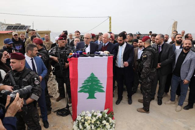 Lebanon's Prime Minister Nawaf Salam speaks to the residents and press corps during his visit to the heavily-damaged southern village of Kfar Shouba, near the border with Israel on February 8, 2026. Swathes of south Lebanon's border areas remain in ruins and largely deserted more than a year after a US-brokered November 2024 ceasefire sought to end hostilities between Israel and the Iran-backed group. Salam vowed authorities would begin key projects including restoring roads, communications networks and water in the two towns (Photo by Rabih DAHER / AFP)
