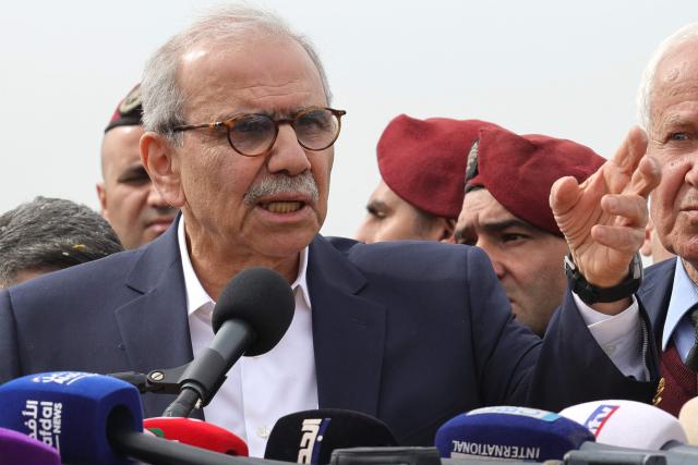 Lebanon's Prime Minister Nawaf Salam speaks to the residents and press corps during his visit to the heavily-damaged southern village of Kfar Shouba, near the border with Israel on February 8, 2026. Swathes of south Lebanon's border areas remain in ruins and largely deserted more than a year after a US-brokered November 2024 ceasefire sought to end hostilities between Israel and the Iran-backed group. Salam vowed authorities would begin key projects including restoring roads, communications networks and water in the two towns (Photo by Rabih DAHER / AFP)