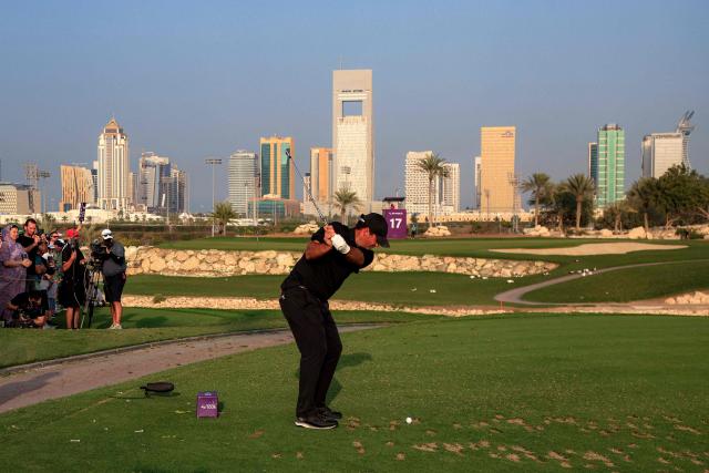 US' Patrick Reed plays a shot on the 17th hole during the final of the Qatar Masters 2026 golf tournament at Doha Golf Club in Doha on February 8, 2026. (Photo by Karim JAAFAR / AFP)