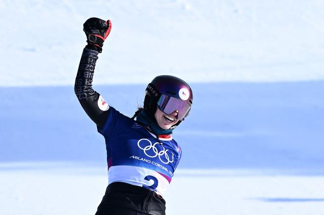 Czech Republic's Zuzana Maderova celebrates winning the snowboard women's parallel giant slalom final at Livigno Snow Park during the Milano Cortina 2026 Winter Olympic Games, in Livigno (Valtellina), on February 8, 2026. (Photo by Kirill KUDRYAVTSEV / AFP)