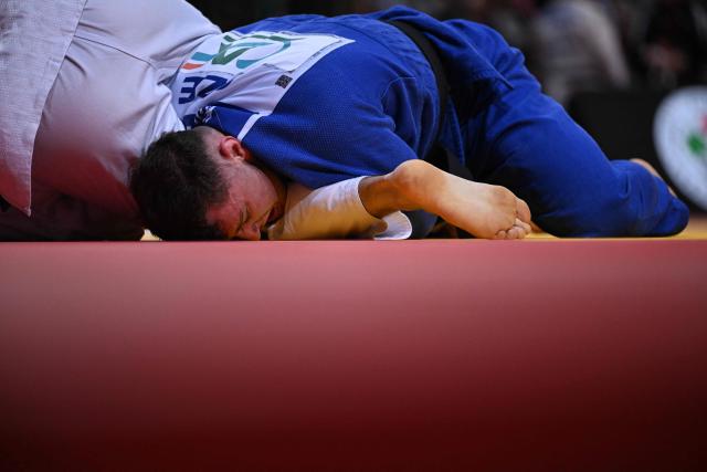 France's Alexis Mathieu competes against Czech Adam Kopecky during their men's -90kg play-off match at the Paris Grand Slam judo tournament in Paris on February 8, 2026. (Photo by Julie SEBADELHA / AFP)