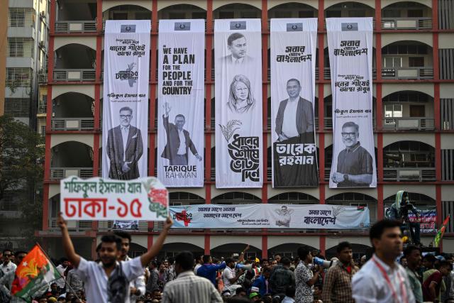 Campaign banners hang on a building's facade during an election rally of the Bangladesh Nationalist Party (BNP) ahead of the country's general election in Dhaka on February 8, 2026. Bangladesh's elections next week could reshape South Asia's balance of power, as Beijing seeks to consolidate influence and ties with India falter, analysts say. (Photo by Sajjad HUSSAIN / AFP)