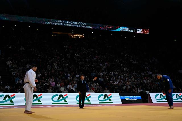 Ukraine's Anton Savytskiy (R) reacts from a distance after winning over Russia's Nilaz Bilalov their men's -100kg demi-final at the Paris Grand Slam judo tournament in Paris on February 8, 2026. (Photo by Julie SEBADELHA / AFP)