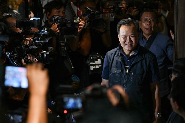 TOPSHOT - Thailand's Prime Minister and Bhumjaithai Party leader Anutin Charnvirakul arrives at his party's headquarters to await results in Thailand's general election in Bangkok on February 8, 2026. (Photo by ANTHONY WALLACE / AFP)