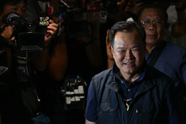 Thailand's Prime Minister and Bhumjaithai Party leader Anutin Charnvirakul arrives at his party's headquarters to await results in Thailand's general election in Bangkok on February 8, 2026. (Photo by ANTHONY WALLACE / AFP)