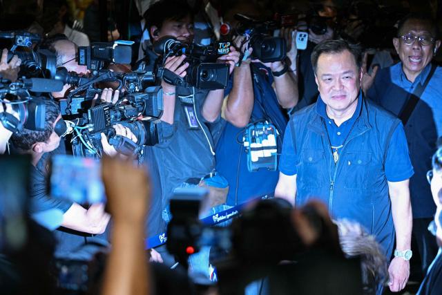 Thailand's Prime Minister and Bhumjaithai Party leader Anutin Charnvirakul arrives at his party's headquarters to await results in Thailand's general election in Bangkok on February 8, 2026. (Photo by ANTHONY WALLACE / AFP)