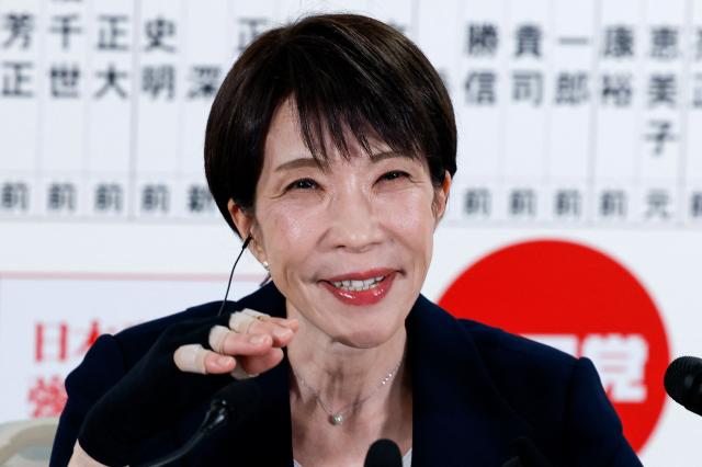 Japan's Prime Minister and President of the Liberal Democratic Party (LDP), Sanae Takaichi, speaks with media on the House of Representatives election day at the LDP headquarters in Tokyo on February 8, 2026. (Photo by Kim Kyung-Hoon / POOL / AFP)