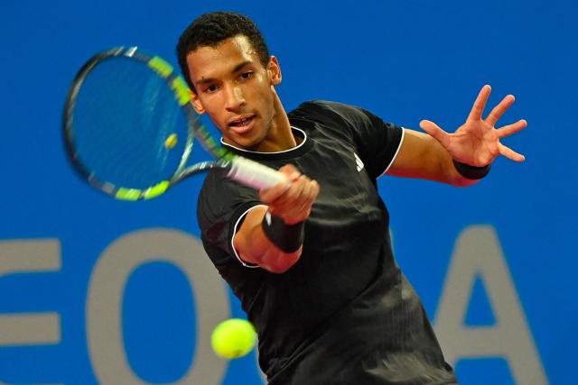 Canada's Felix Auger Aliassime returns the ball to France's Adrian Mannarino during their ATP World Tour Open Occitanie Men's final tennis match in Montpellier, southern France on February 8, 2026. (Photo by Sylvain THOMAS / AFP)