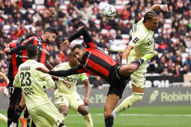 Nice's Ghanaian defender #37 Kojo Peprah Oppong (L), Nice's Tunisian defender #02 Ali Abdi (C) fight for the ball with Monaco's German defender #05 Thilo Kehrer (R) during the French L1 football match between OGC Nice and AS Monaco at the Allianz Riviera Stadium in Nice, south-eastern France on February 8, 2026.  (Photo by Valery HACHE / AFP)