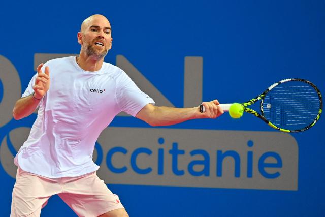 France's Adrian Mannarino returns the ball to Canada's Felix Auger Aliassime during their ATP World Tour Open Occitanie Men's final tennis match in Montpellier, southern France on February 8, 2026. (Photo by Sylvain THOMAS / AFP)
