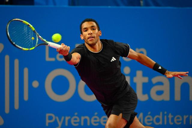 Canada's Felix Auger Aliassime plays a forehand return to France's Adrian Mannarino during their ATP World Tour Open Occitanie Men's final tennis match in Montpellier, southern France on February 8, 2026. (Photo by Sylvain THOMAS / AFP)