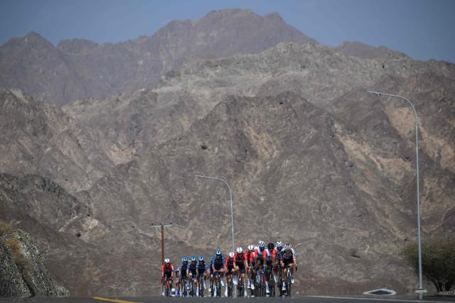 The pack rides during the 2nd stage of the Tour of Oman cycling race from Al Rustaq Fort to Yitti Hills, on February 8, 2026. (Photo by Loic VENANCE / AFP)