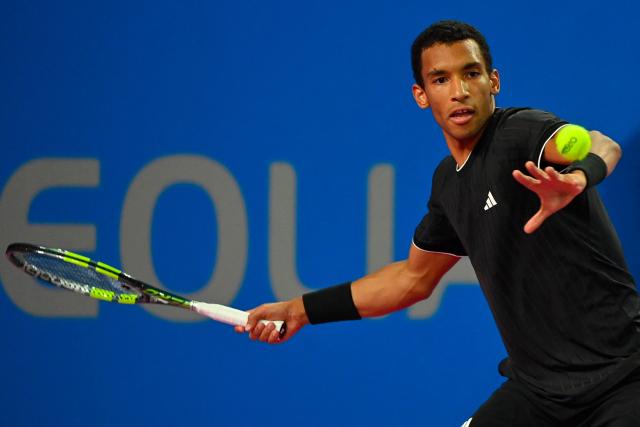 Canada's Felix Auger Aliassime returns the ball to France's Adrian Mannarino during their ATP World Tour Open Occitanie Men's final tennis match in Montpellier, southern France on February 8, 2026. (Photo by Sylvain THOMAS / AFP)