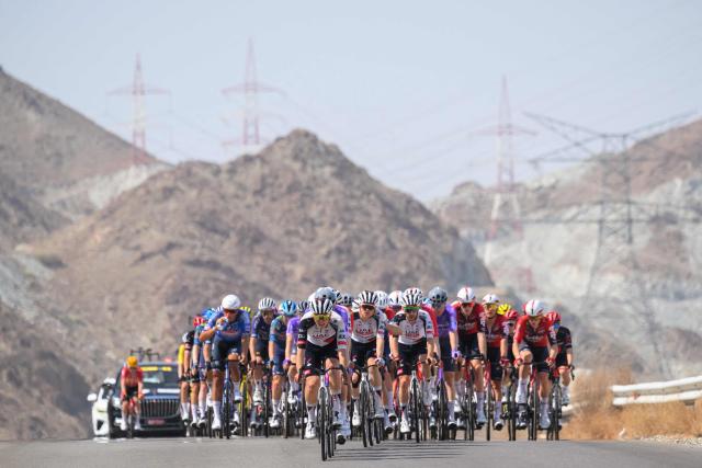 The pack rides during the 2nd stage of the Tour of Oman cycling race from Al Rustaq Fort to Yitti Hills, on February 8, 2026. (Photo by Loic VENANCE / AFP)