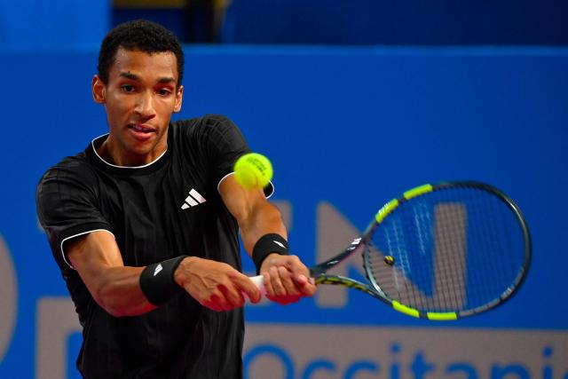 Canada's Felix Auger Aliassime returns the ball to France's Adrian Mannarino during their ATP World Tour Open Occitanie Men's final tennis match in Montpellier, southern France on February 8, 2026. (Photo by Sylvain THOMAS / AFP)
