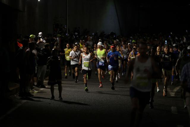 Runners take part in the 21 km and 42 km races of the 10th edition of the CAF Marathon in Caracas on February 8, 2026. (Photo by Pedro MATTEY / AFP)