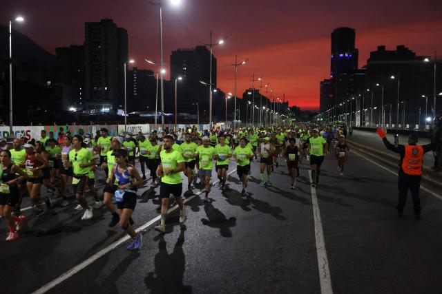 Runners take part in the 21 km and 42 km races of the 10th edition of the CAF Marathon in Caracas on February 8, 2026. (Photo by Pedro MATTEY / AFP)