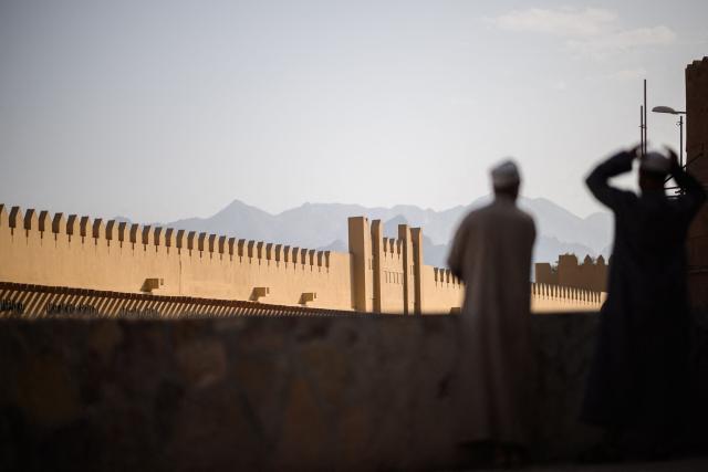 Spectators wait for the start of the 2nd stage of the Tour of Oman cycling race from Al Rustaq Fort to Yitti Hills, on February 8, 2026. (Photo by Loic VENANCE / AFP)