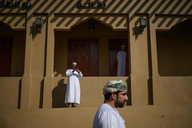 Spectators wait for the start of the 2nd stage of the Tour of Oman cycling race from Al Rustaq Fort to Yitti Hills, on February 8, 2026. (Photo by Loic VENANCE / AFP)