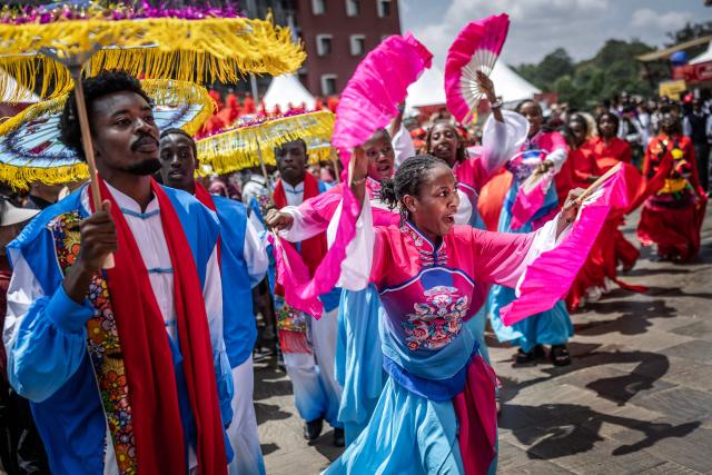 Students from the Confucius Institute take part in a traditional dance performance during celebrations marking the Chinese Lunar New Year in Nairobi, on February 8, 2026, ahead of the upcoming Lunar New Year of the Horse. (Photo by Luis TATO / AFP)