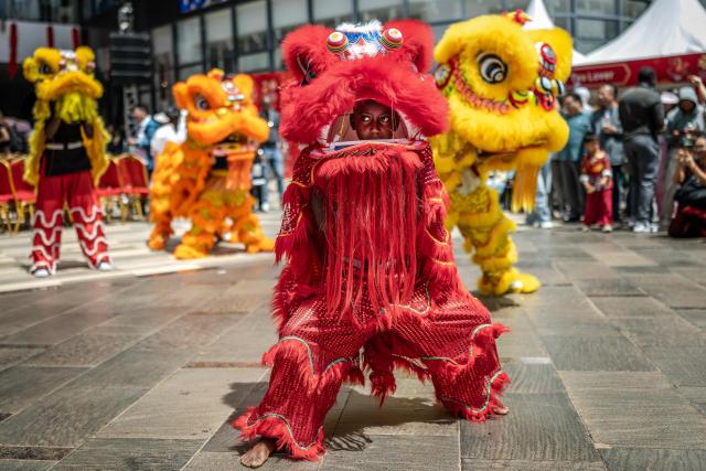 TOPSHOT - Students from the Confucius Institute prepare for a lion dance performance during celebrations marking the Chinese Lunar New Year in Nairobi, on February 8, 2026, ahead of the upcoming Lunar New Year of the Horse. (Photo by Luis TATO / AFP)