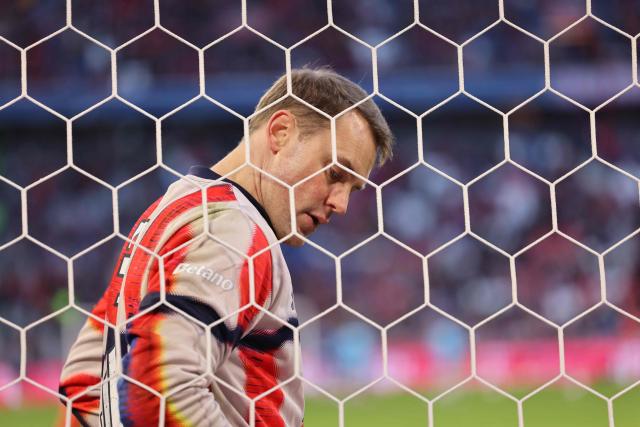 Bayern Munich's German goalkeeper #01 Manuel Neuer warms up ahead the German first division Bundesliga football match between FC Bayern Munich and TSG 1899 Hoffenheim in Munich, southern Germany on February 8, 2026. (Photo by Alexandra BEIER / AFP) / DFL REGULATIONS PROHIBIT ANY USE OF PHOTOGRAPHS AS IMAGE SEQUENCES AND/OR QUASI-VIDEO