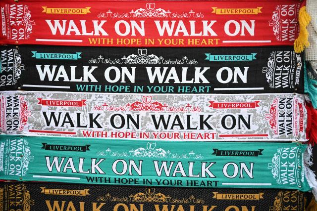 Liverpool merchandise is pictured for sale outside the grounds before the start of the English Premier League football match between Liverpool and Manchester City at Anfield in Liverpool, north west England on February 8, 2026. (Photo by Paul ELLIS / AFP)