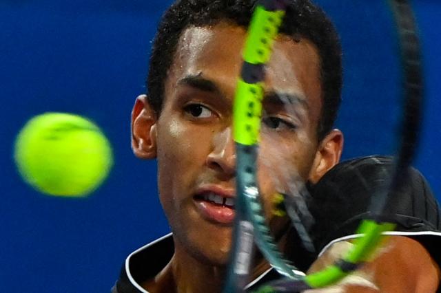 Canada's Felix Auger Aliassime returns the ball to France's Adrian Mannarino during their ATP World Tour Open Occitanie Men's final tennis match in Montpellier, southern France on February 8, 2026. (Photo by Sylvain THOMAS / AFP)