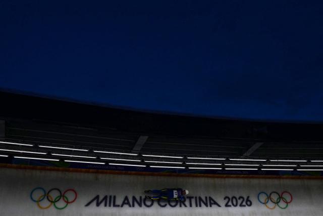 Ukraine's Anton Dukach competes in the luge men's singles run 3 at Cortina Sliding Centre during the Milano Cortina 2026 Winter Olympic Games in Cortina d'Ampezzo on February 8, 2026. (Photo by Stefano RELLANDINI / AFP)