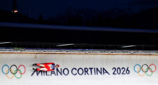 Poland's Mateusz Sochowicz  competes in the luge men's singles run 3 at Cortina Sliding Centre during the Milano Cortina 2026 Winter Olympic Games in Cortina d'Ampezzo on February 8, 2026. (Photo by Stefano RELLANDINI / AFP)
