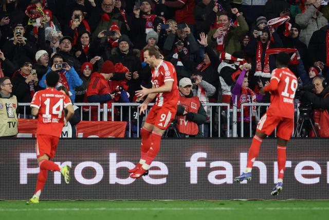 Bayern Munich's English forward #09 Harry Kane (C) celebrates scoring his team's first goal during the German first division Bundesliga football match between FC Bayern Munich and TSG 1899 Hoffenheim in Munich, southern Germany on February 8, 2026. (Photo by Alexandra BEIER / AFP) / DFL REGULATIONS PROHIBIT ANY USE OF PHOTOGRAPHS AS IMAGE SEQUENCES AND/OR QUASI-VIDEO