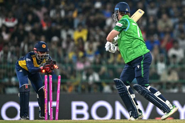 Sri Lanka's Kusal Mendis (L) stumps out Ireland's Ben Calitz (R) during the 2026 ICC Men's T20 Cricket World Cup group stage match between Sri Lanka and Ireland at the R Premadasa Stadium in Colombo on February 8, 2026. (Photo by Ishara S. KODIKARA / AFP)