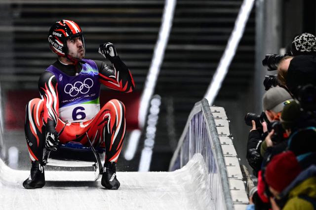 Austria's Nico Gleirscher reacts in the finish area after competing in the luge men's singles run 4 at Cortina Sliding Centre during the Milano Cortina 2026 Winter Olympic Games in Cortina d'Ampezzo on February 8, 2026. (Photo by Stefano RELLANDINI / AFP)