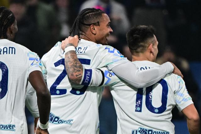Inter Milan's Swiss defender #25 Manuel Akanji (C) celebrates after scoring his team's fourth goal during the Italian Serie A football match between Sassuolo and Inter Milan at the Mapei Stadium in Reggio Emilia, Italy on February 8, 2026. (Photo by Piero CRUCIATTI / AFP)