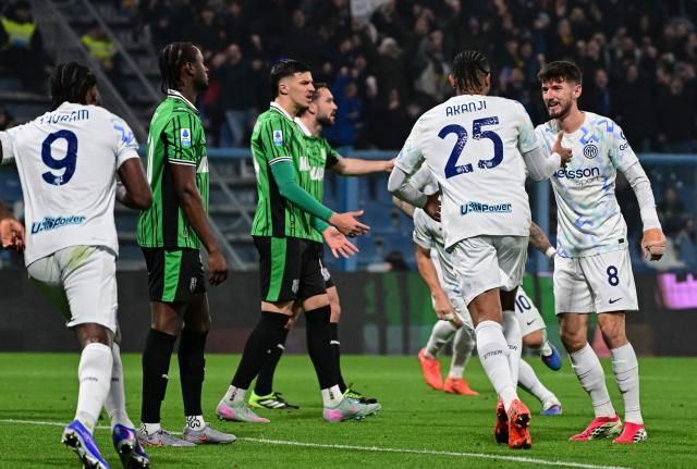 Inter Milan's Swiss defender #25 Manuel Akanji (C) celebrates after scoring his team's fourth goal during the Italian Serie A football match between Sassuolo and Inter Milan at the Mapei Stadium in Reggio Emilia, Italy on February 8, 2026. (Photo by Piero CRUCIATTI / AFP)
