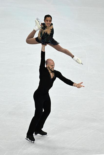 USA's Ellie Kam (above) and USA's Danny O'Shea (below) compete in the figure skating pair free skating team event during the Milano Cortina 2026 Winter Olympic Games at Milano Ice Skating Arena in Milan on February 8, 2026. (Photo by JULIEN DE ROSA / AFP)