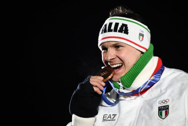 Bronze medallist Italy's Dominik Fischnaller poses  on the podium of the luge men's singles at Cortina Sliding Centre during the Milano Cortina 2026 Winter Olympic Games in Cortina d'Ampezzo on February 8, 2026. (Photo by Marco BERTORELLO / AFP)