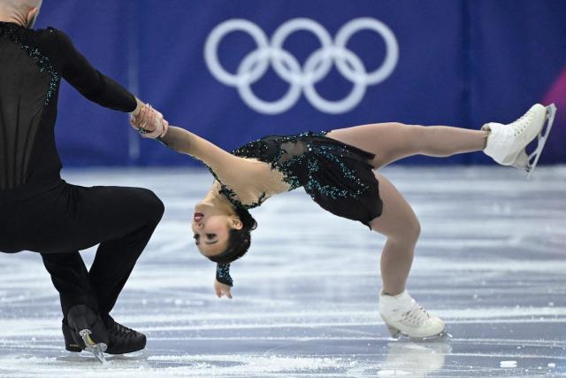 USA's Ellie Kam (R) and USA's Danny O'Shea (L) compete in the figure skating pair free skating team event during the Milano Cortina 2026 Winter Olympic Games at Milano Ice Skating Arena in Milan on February 8, 2026. (Photo by WANG Zhao / AFP)