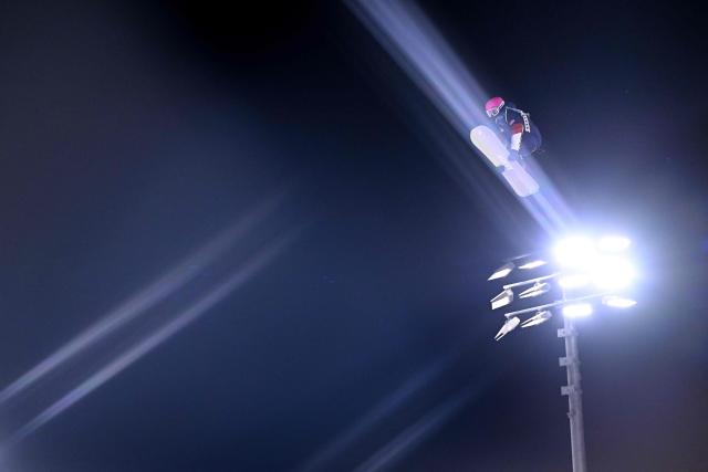 USA's Lily Dhawornvej competes in the snowboard women's big air qualification run 2 at Livigno Snow Park during the Milano Cortina 2026 Winter Olympic Games, in Livigno (Valtellina), on February 8, 2026. (Photo by Kirill KUDRYAVTSEV / AFP)