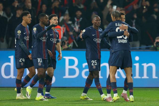 Paris Saint-Germain's French forward #10 Ousmane Dembele (2L) celebrates with teammates after scoring Paris Saint-Germain's first goal during the French L1 football match between Paris Saint-Germain (PSG) and Olympique de Marseille (OM) at the Parc des Princes stadium in Paris on February 8, 2026. (Photo by GEOFFROY VAN DER HASSELT / AFP)