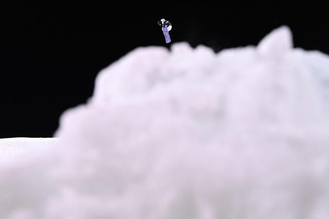 Japan's Reira Iwabuchi competes in the snowboard women's big air qualification run 3 at Livigno Snow Park during the Milano Cortina 2026 Winter Olympic Games, in Livigno (Valtellina), on February 8, 2026. (Photo by Kirill KUDRYAVTSEV / AFP)