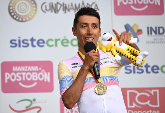 Colombia's cyclist Egan Bernal celebrates on the podium after winning the National Road Cycling Championships in Zipaquira, Colombia, on February 8, 2026. (Photo by Raul ARBOLEDA / AFP)