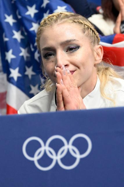 USA's Amber Glenn reacts in the kiss and cry area after competing in the figure skating women's singles free skating team event during the Milano Cortina 2026 Winter Olympic Games at Milano Ice Skating Arena in Milan on February 8, 2026. (Photo by WANG Zhao / AFP)