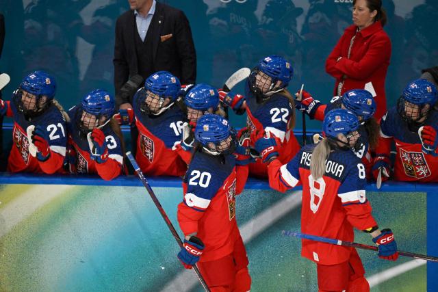 Czech Republic's #20 Barbora Jurickova and Czech Republic's #08 Tereza Pistekova celebrate with team mates after the first goal  during during the women's preliminary round Group A Ice Hockey match between Czech Republic and Finland at the Milano Rho Ice Hockey Arena at the Milano Cortina 2026 Winter Olympic Games in Milan, on February 8, 2026. (Photo by Alexander NEMENOV / AFP)
