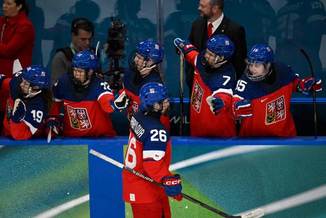 Czech Republic's #26 Vendula Pribylova celebrates with team mates during during the women's preliminary round Group A Ice Hockey match between Czech Republic and Finland at the Milano Rho Ice Hockey Arena at the Milano Cortina 2026 Winter Olympic Games in Milan, on February 8, 2026. (Photo by Alexander NEMENOV / AFP)